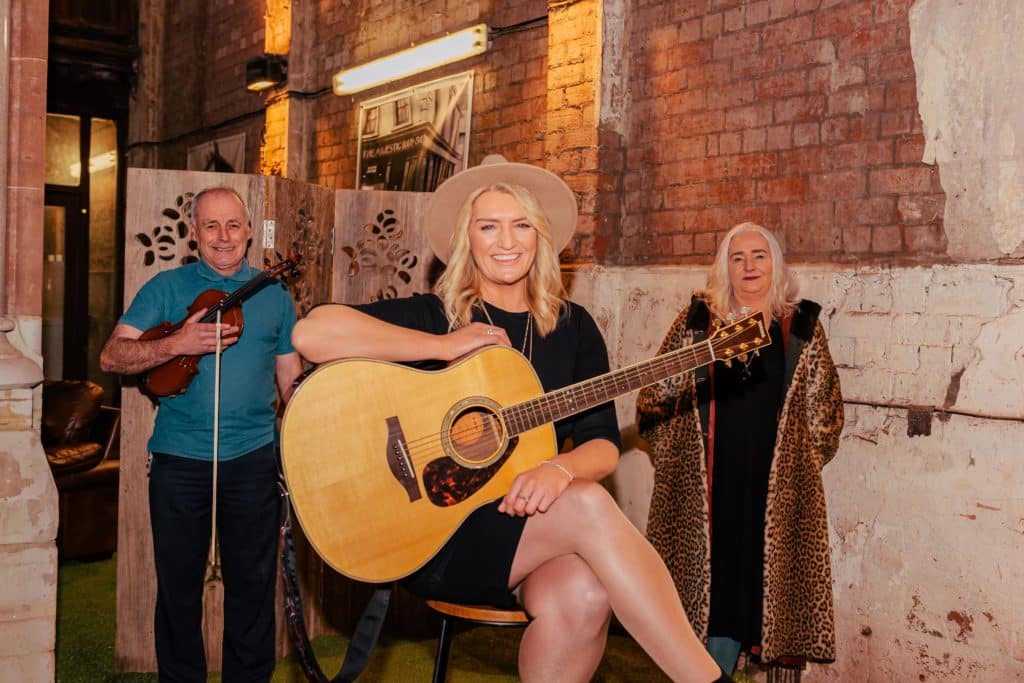 Seamus Lavery of Dalriada Folk, singer songwriter Amanda St John and Terry McKeown, project Manager at Sailortown Regeneration